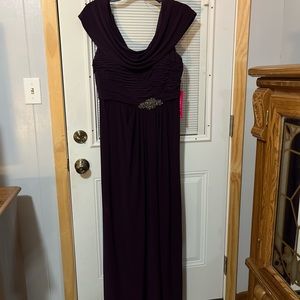 Alex Evenings eggplant floor length gown with slit.